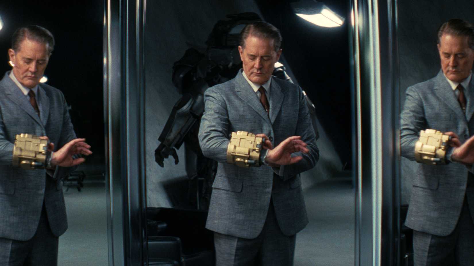 Hank MacLean looking at a pipboy on his arm in Fallout season 2