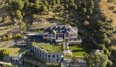 stepped hill house emerges from the terrain in india