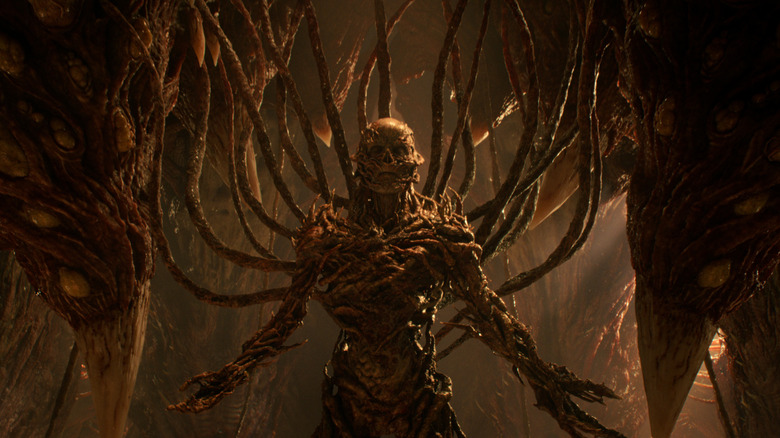 Vecna wired into the hive mind of the Abyss with tentacles stuck in his back in 