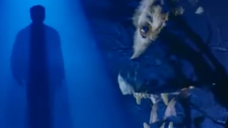 The face of a werewolf looming over the silhouette of David Hasselhoff as Mitch Buchannon in the opening titles of Baywatch Nights Season 2