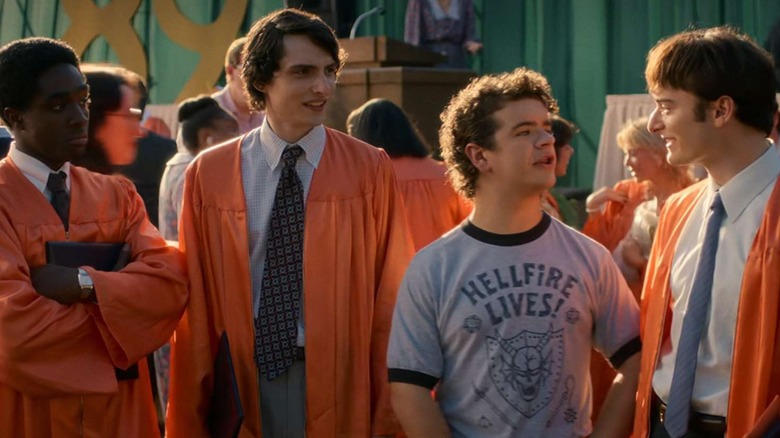 Lucas Mike Dustin and Will talking at graduation in Stranger Things