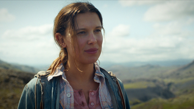 Eleven hiking up a beautiful cliff in a vision of one possible future in the Stranger Things Season 5 finale (2025)