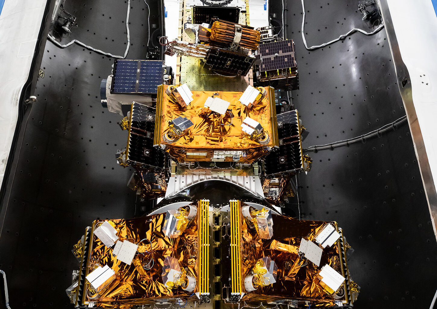 NASA’s Pandora small satellite, and NASA-sponsored Star-Planet Activity Research CubeSat (SPARCS), and Black Hole Coded Aperture Telescope (BlackCAT) CubeSat, inside a SpaceX Falcon 9 payload fairing
