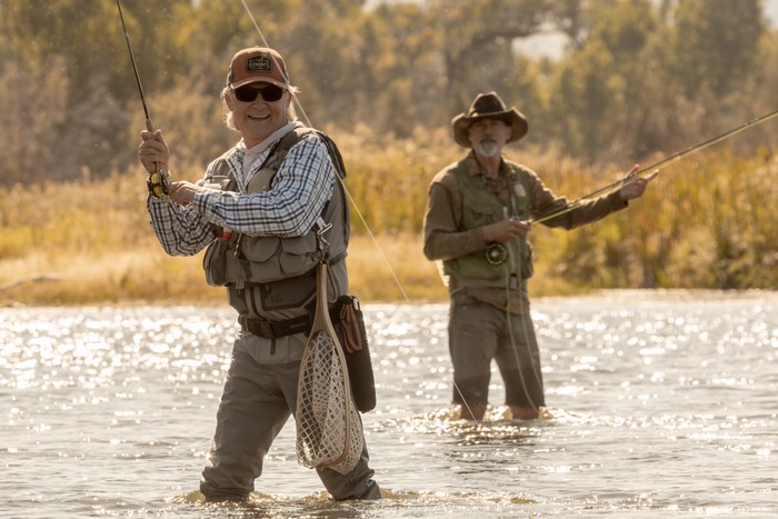 Early Release Images Kurt Russell as Preston Clyburn and Matthew Fox as Paul Clyburn in The Madison standing in water and fly fishing.