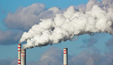 smoke coming out of industrial chimneys.