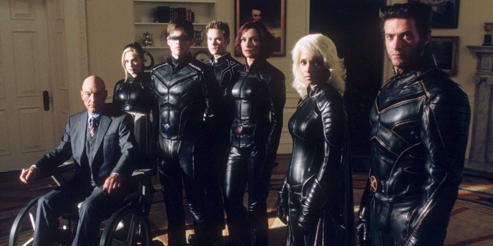 Patrick Stewart, Anna Paquin, James Marsden, Shawn Ashmore, Famke Janssen, Halle Berry, and Hugh Jackman in an office in X-Men 2