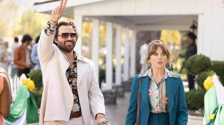 Jake Johnson's Doug Renetti looking happy and Ophelia Lovibond's Joyce Prigger aghast on Minx