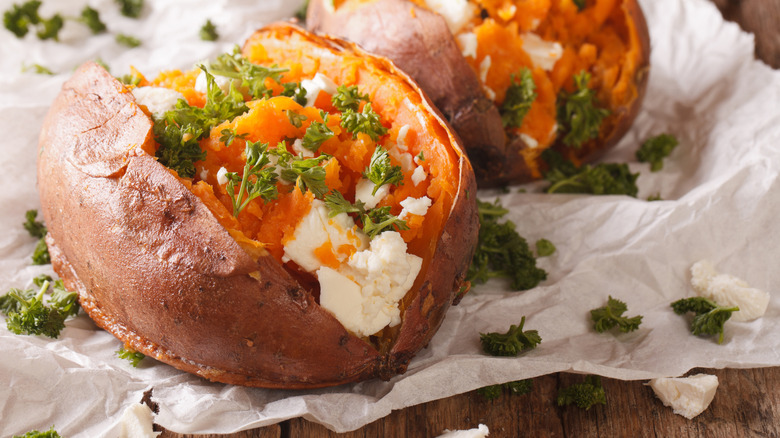 Baked sweet potato with parsley and feta cheese