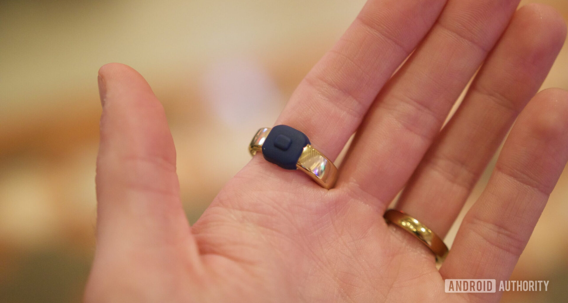 Someone wearing the Pebble Index 01 ring, showing the button.