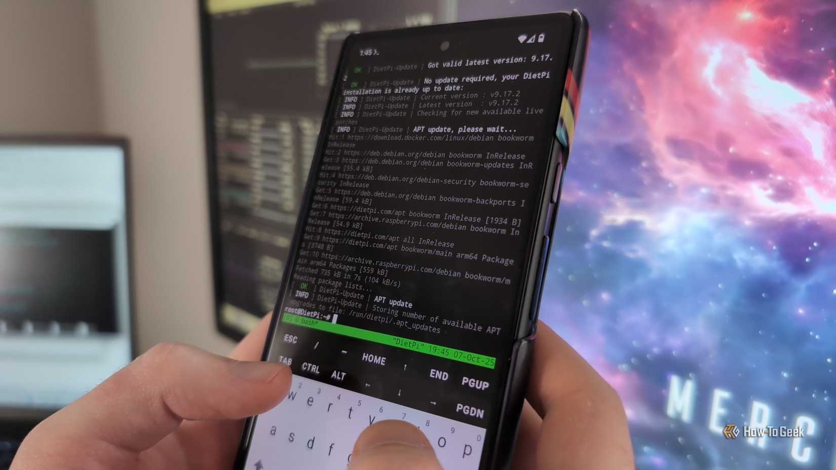 Person's hands holding an Android phone with the Termux app open and a Linux terminal visible.
