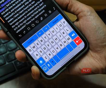 Personl holding a Samsung Galaxy Z Flip 6 with the AnySoftKeyboard app open