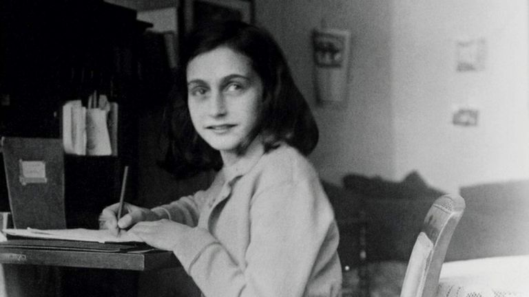 Anne Frank at her desk in her house at the Merwedeplein in Amsterdam. Pic: Reuters