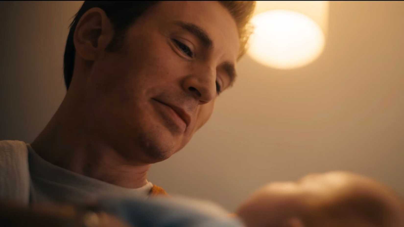 Chris Evans as Steve Rogers holding a baby