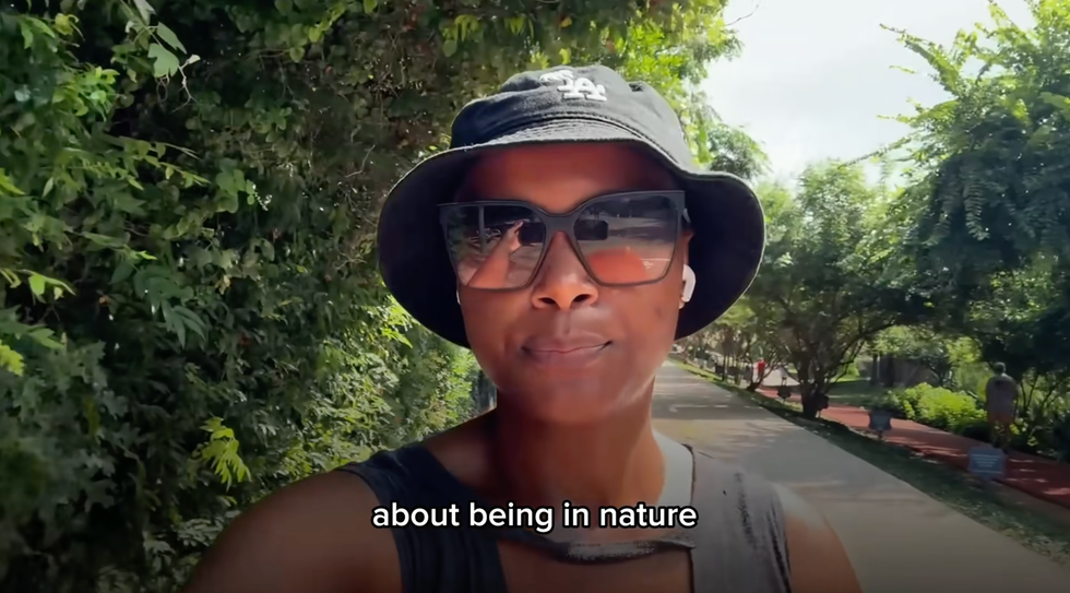 person walking in a natural setting discussing nature