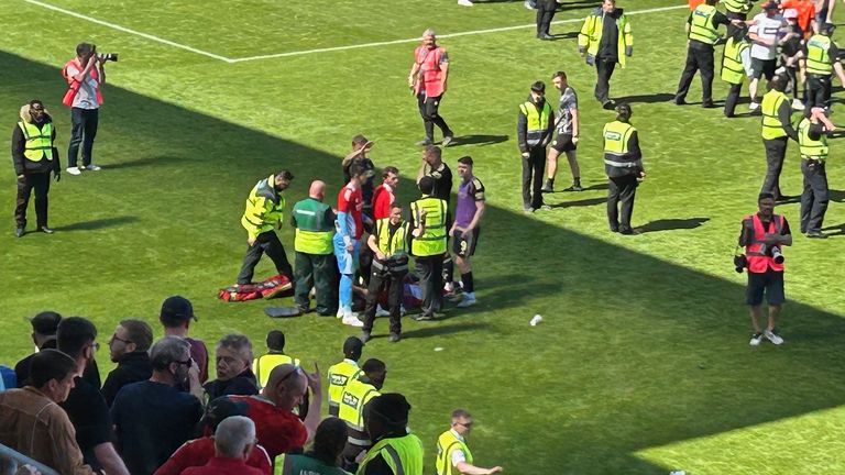 MacKenzie receiving treatment on the pitch. Pic: PA