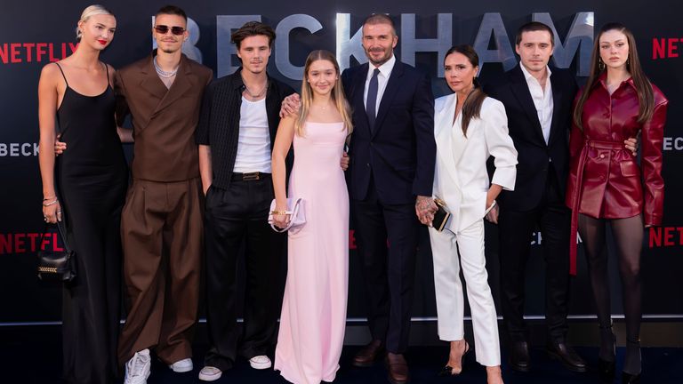 The Beckhams, left to right: Mia Regan, Romeo, Cruz, Harper, David, Victoria, Brooklyn and Nicola Peltz, at a 2023 London premier. Pic: AP