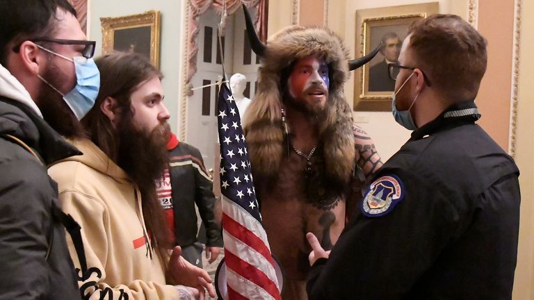 Jake Angeli, whose legal name is Jacob Angeli-Chansley, became the face of the Capitol riots. Pic: Reuters