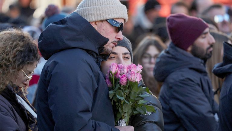Mourners also gathered outside the church during the mass. Pic: Reuters