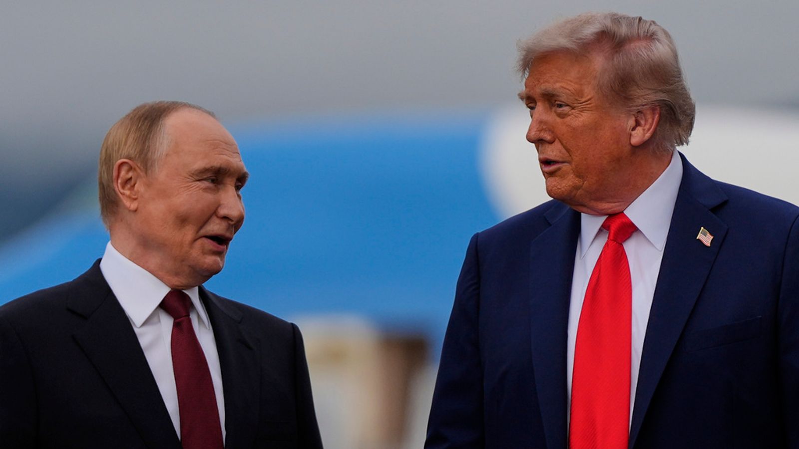 Vladimir Putin, left, with Donald Trump last August. Pic: AP