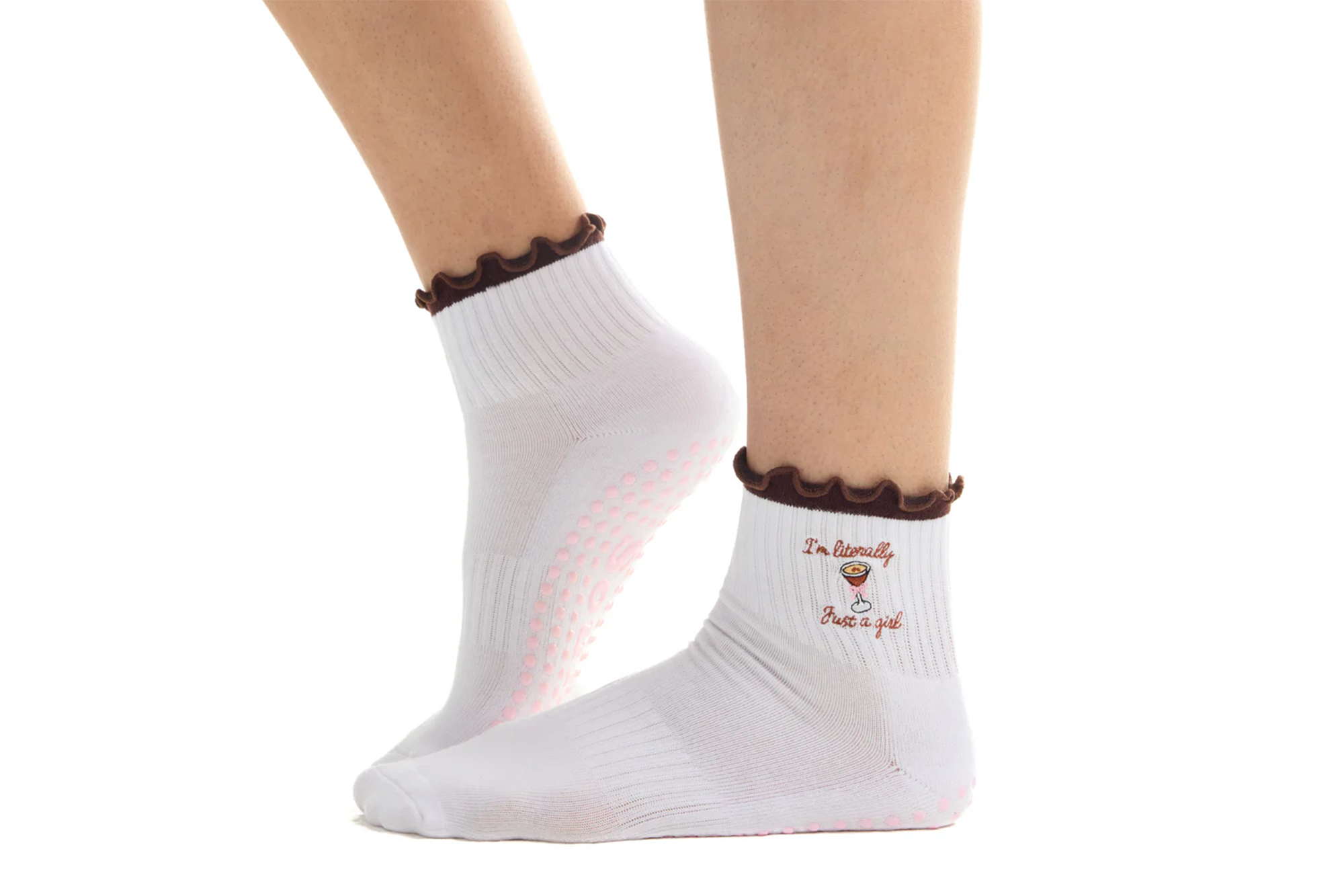 Pair of white non-slip socks with ruffled brown cuffs, one sock embroidered with a martini glass and "I'm literally Just a girl."