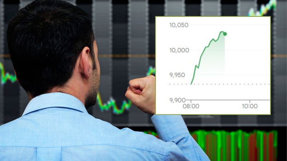 Stock market trader and Ftse 100 graph