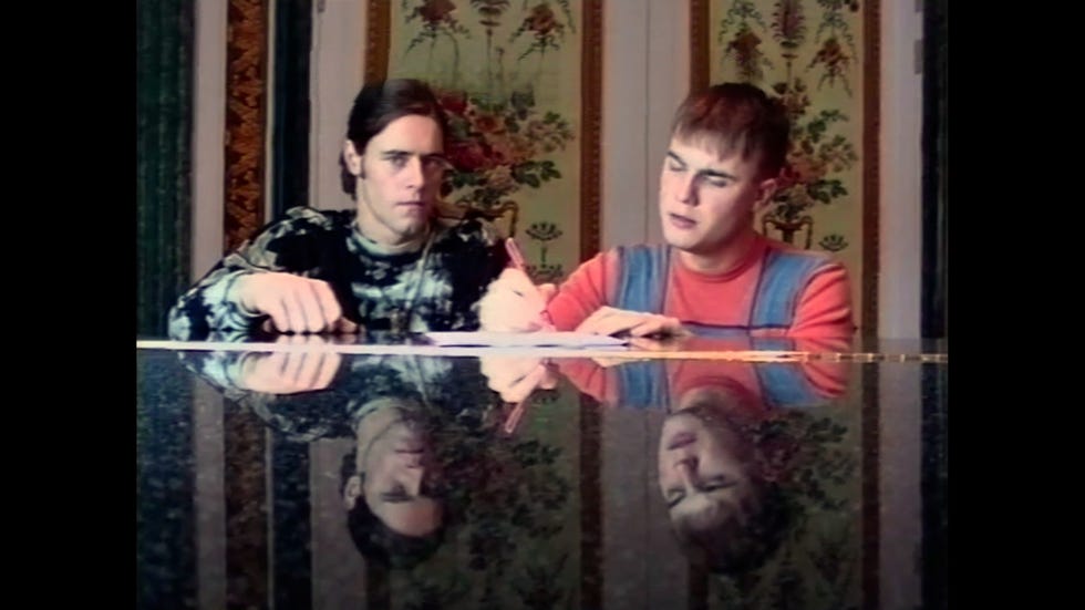 netflix documentary take that robbie williams and gary barlow sitting at a table together