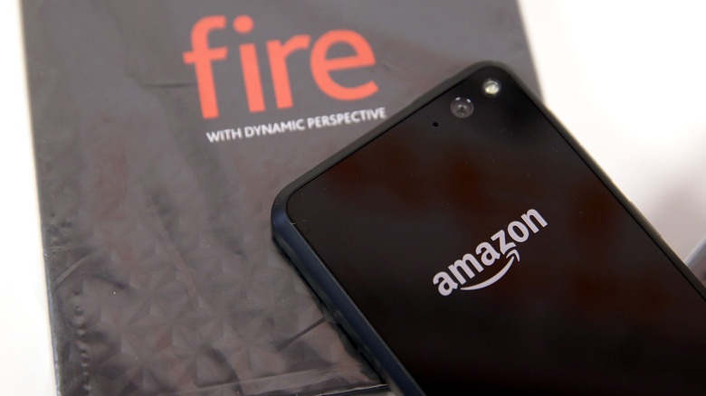 The Amazon Fire Phone next to Amazon Fire branding