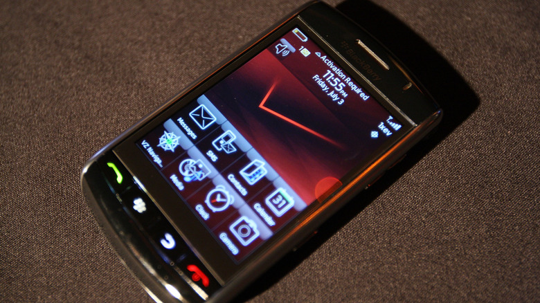 A BlackBerry Storm phone with display on