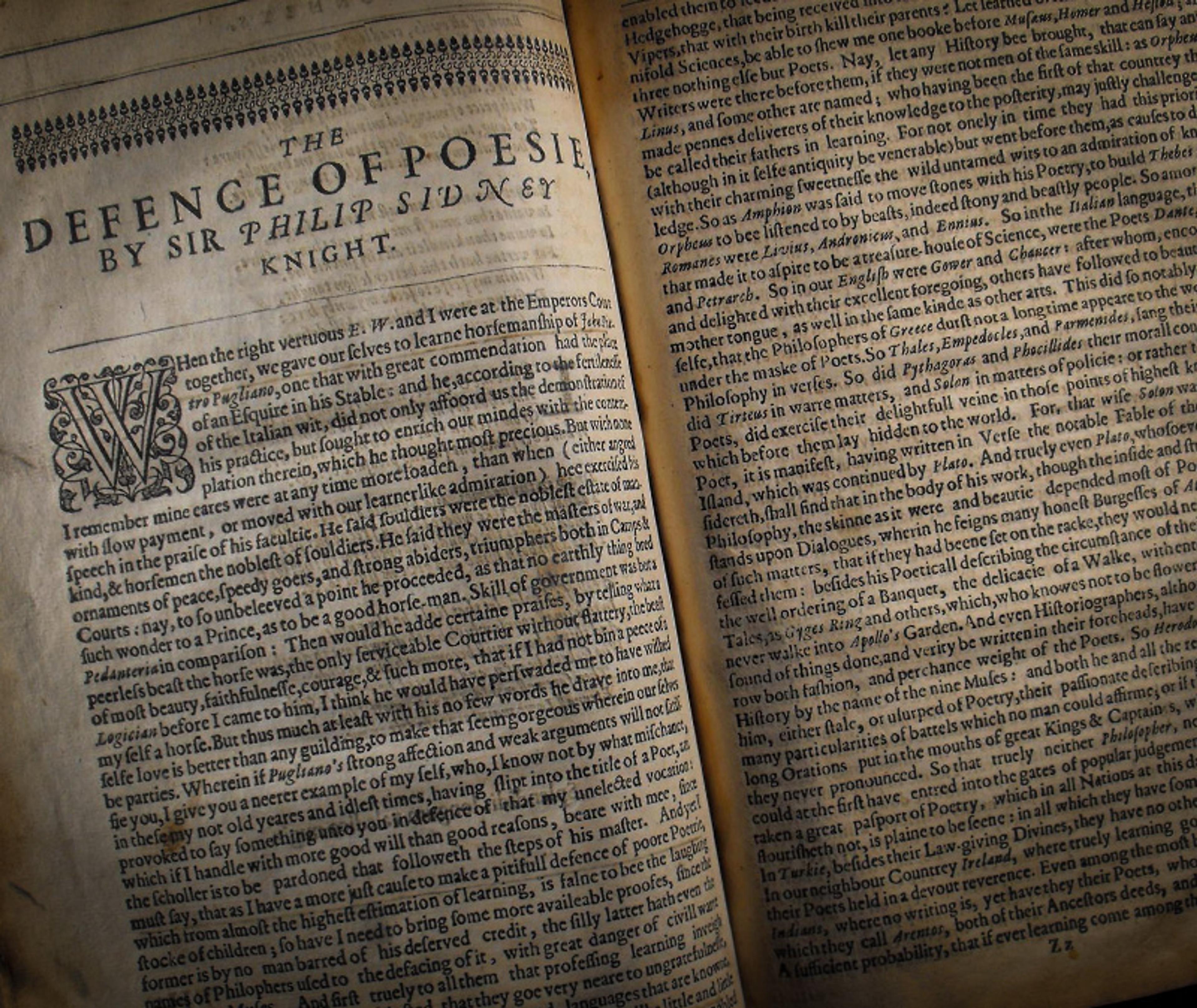 Photo of an open book showing “The Defence of Poesie” by Sir Philip Sidney with aged pages and detailed text.