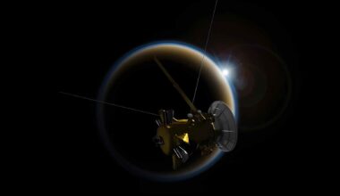 Artist illustration of a spacecraft near Titan, Saturn’s largest moon, with sunlight flaring behind the hazy world in the background.