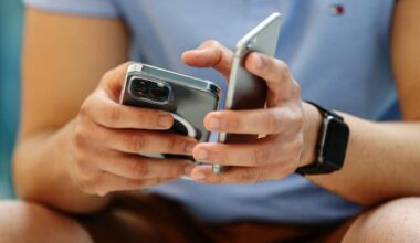 A customer wearing a protective mask tries out an iPhone.