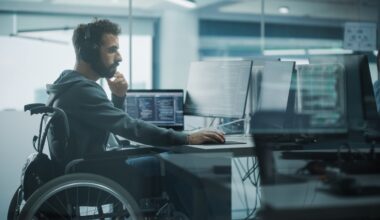 A person works on a computer in an office.