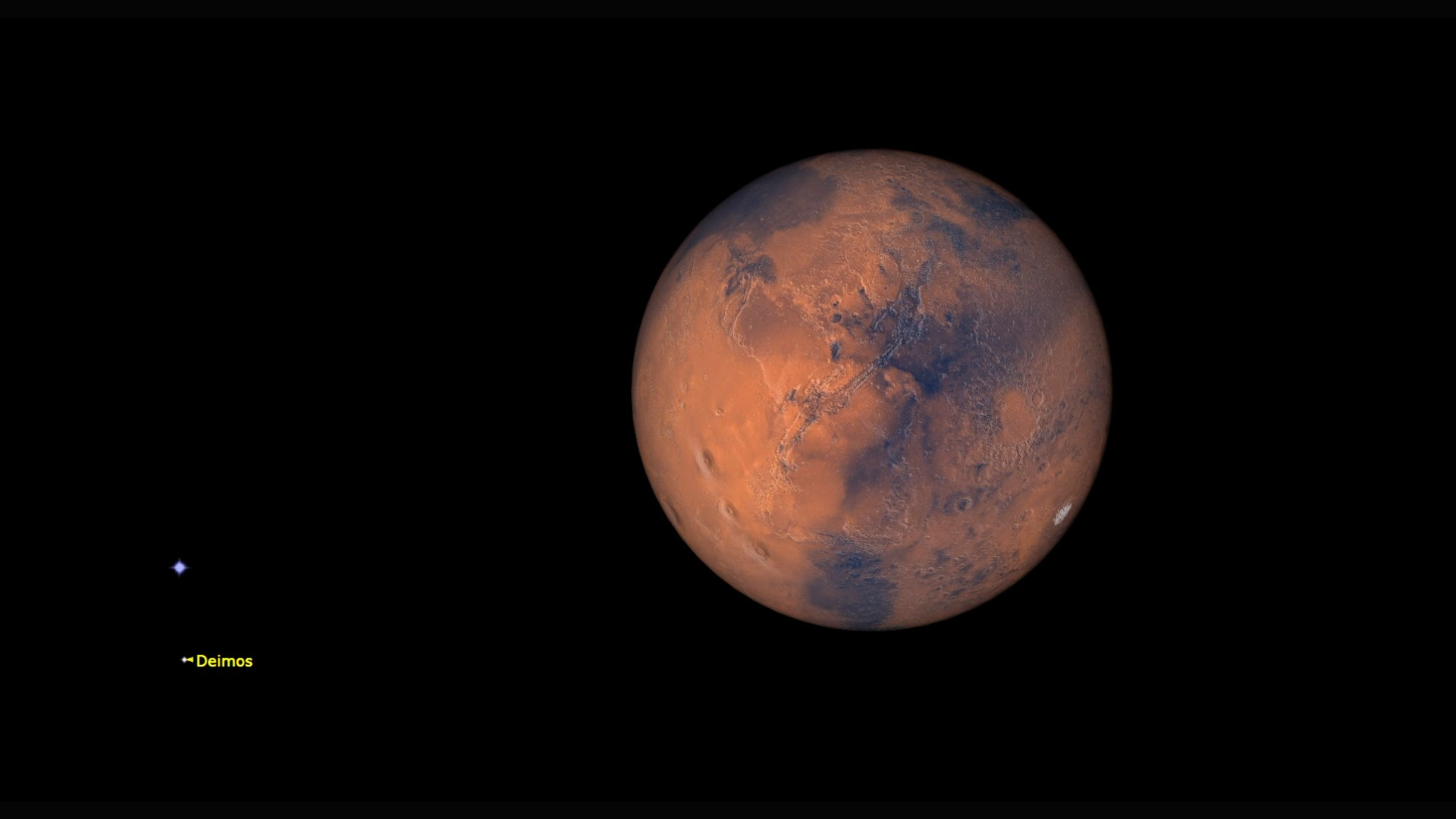 A close up of Mars in the darkness of space with a labeled dot showing its moon Deimos at the left of the image