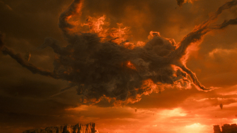 A giant cloud of hive mind smoke swirling over the wasteland of the abyss in the 