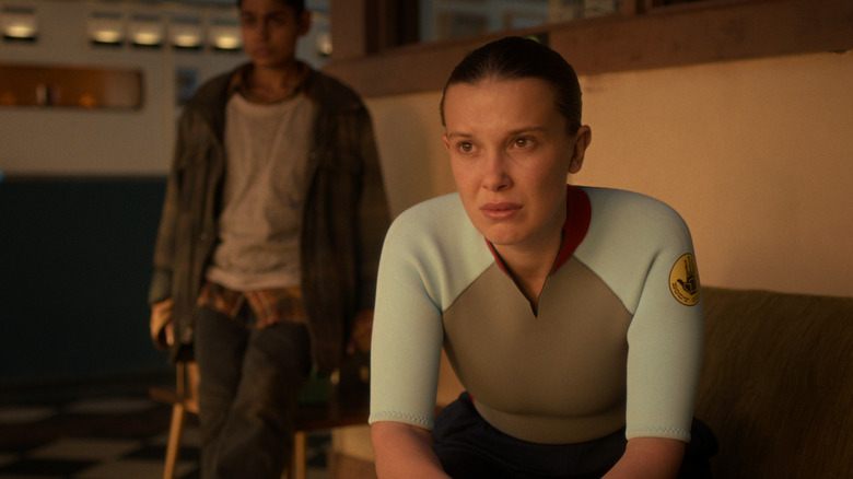 Eleven and Kali sitting in the Hawkins radio station with worried expressions in 