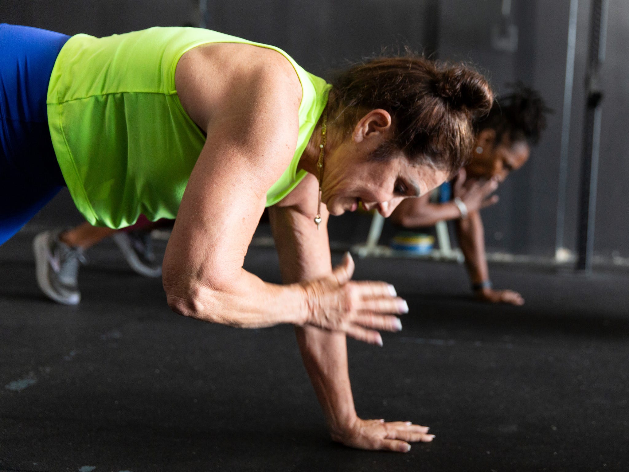 becky hennesy\, left\, and cynthia sanders do shoulder tap exercises at dtx performance co in dallas\, texas\, on june 6\, 2025. 