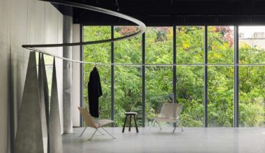 continuous steel rail traces shanghai showroom’s sculptural interior