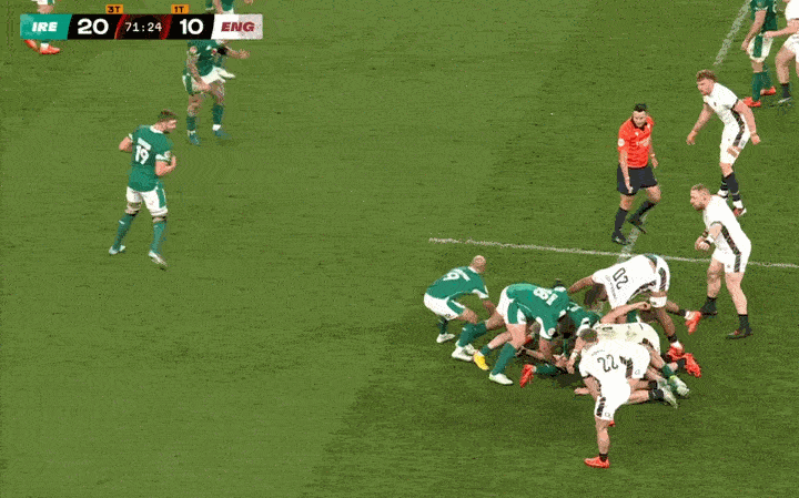 Rugby players from Ireland and England in a scrum with a scoreboard showing IRE 20, ENG 10.