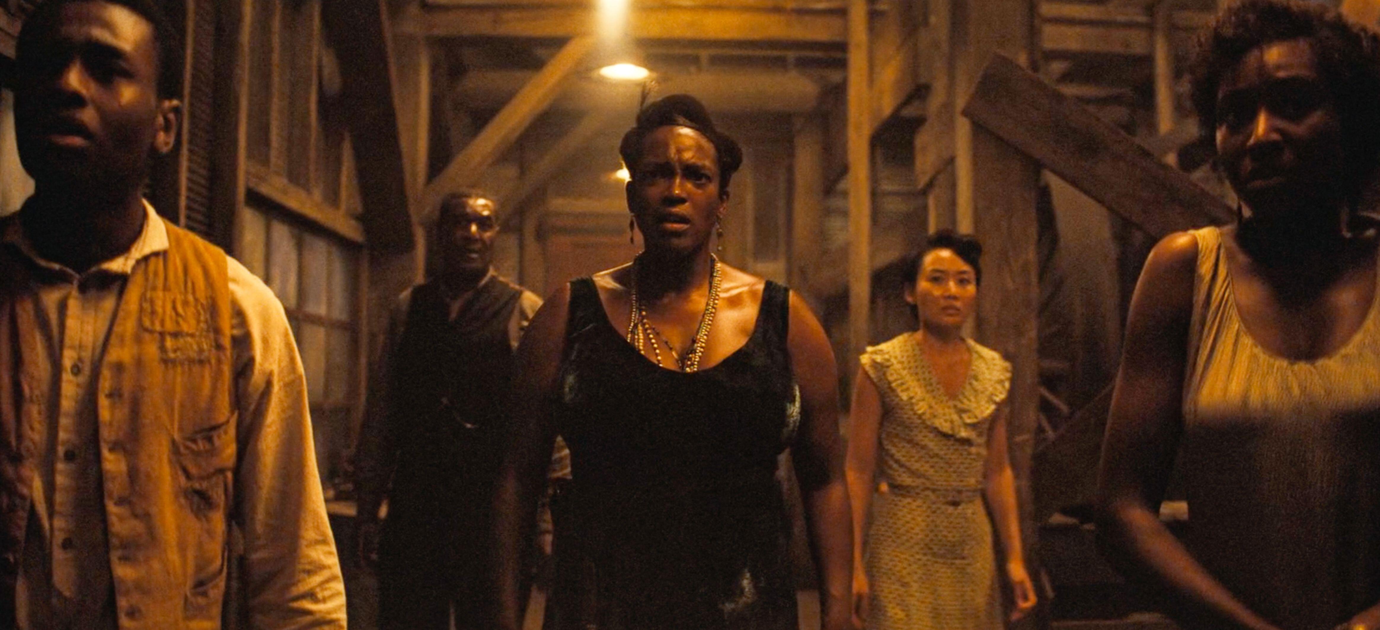 Wunmi Mosaku and fellow cast members in a scene from the movie "Sinners."