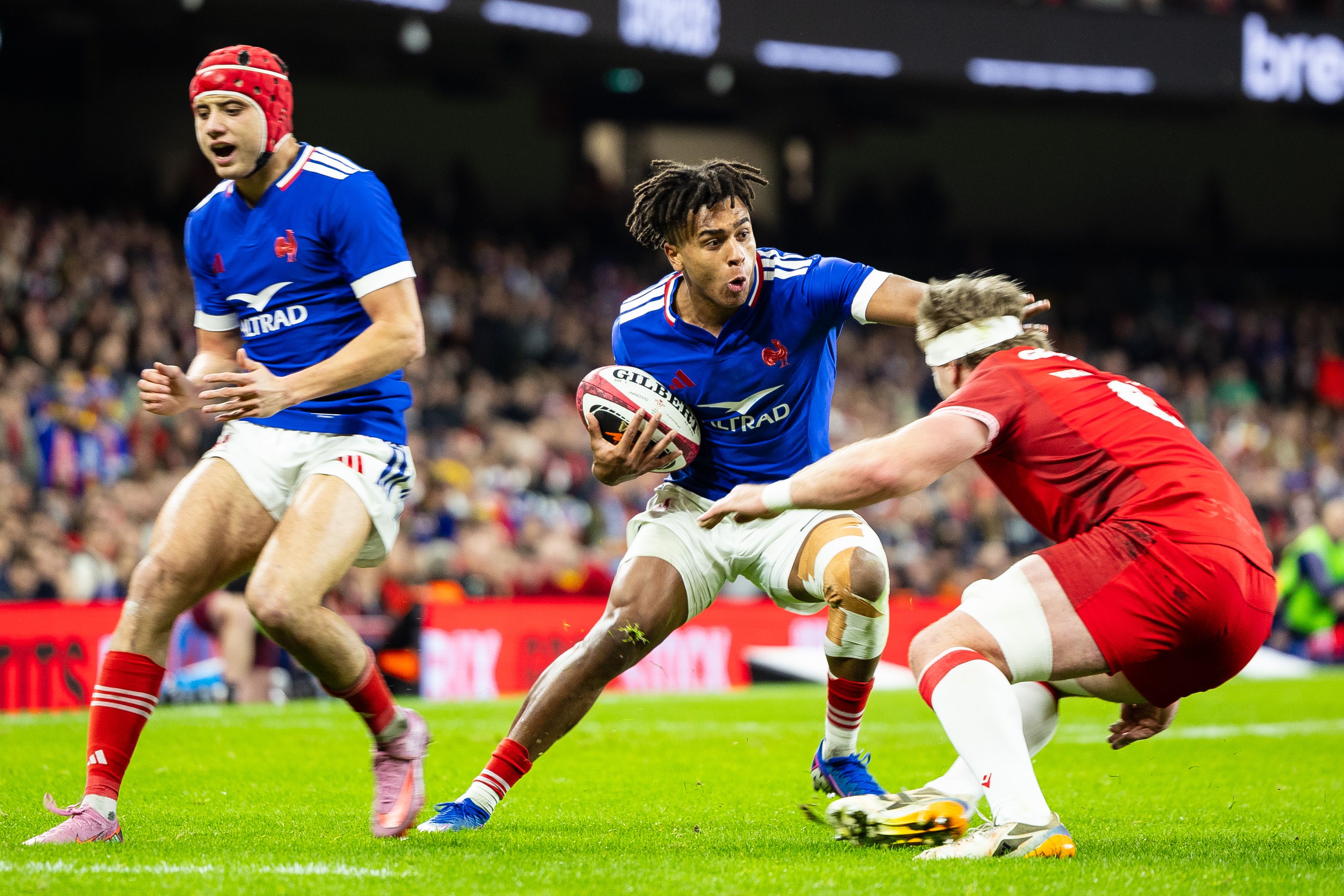 Theo Attissogbe of France under pressure from Aaron Wainwright of Wales during the 6 Nations match.