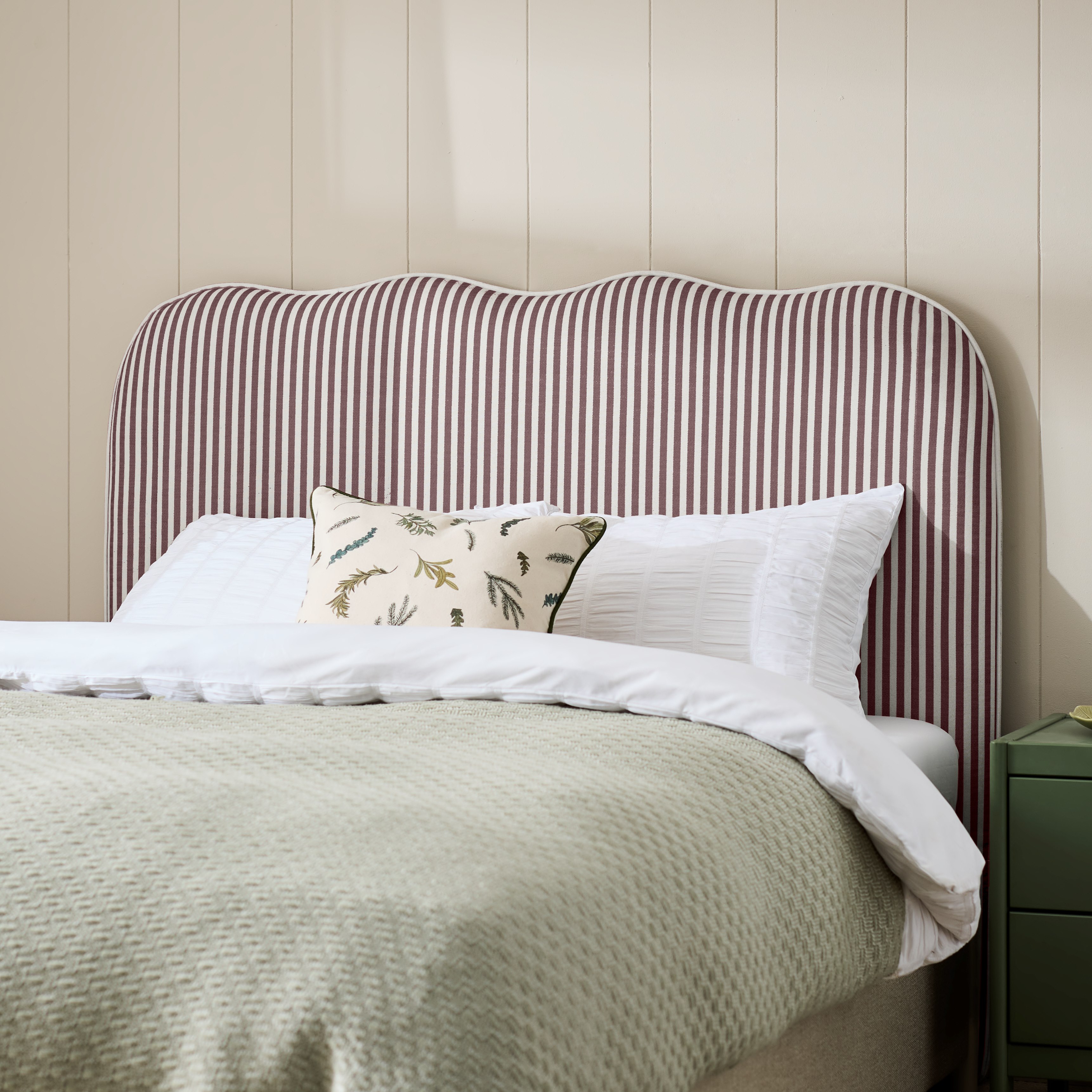 Habitat headboard with purple and white stripes.