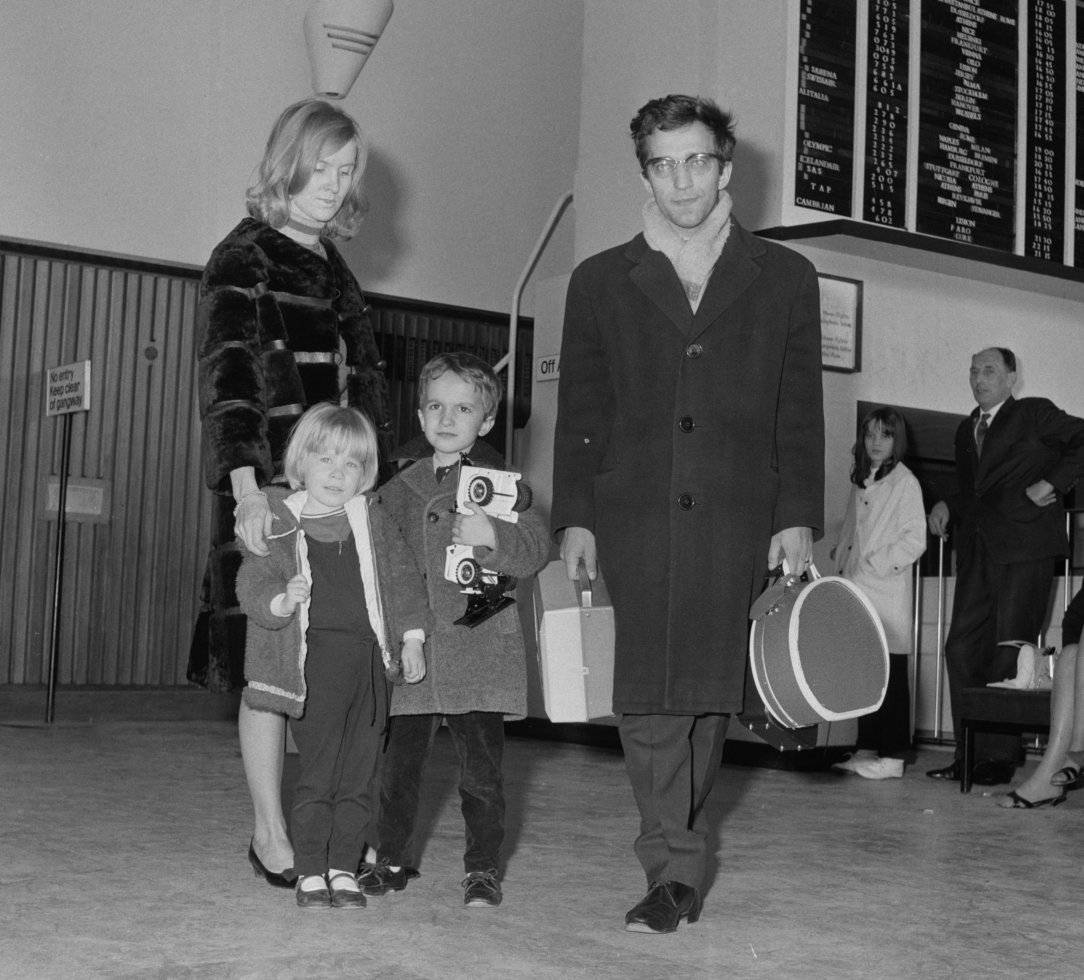 Russian pianist and conductor Vladimir Ashkenazy arriving at Heathrow Airport with his wife and two children.