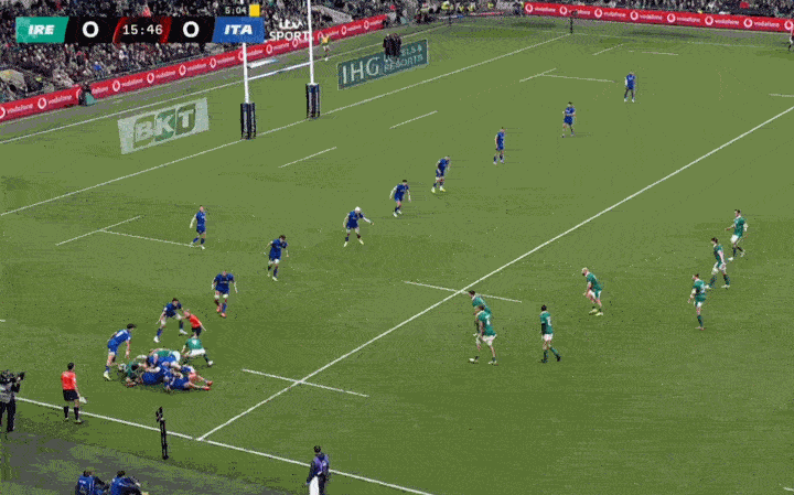 Rugby match between Ireland and Italy, with players in green and blue jerseys.