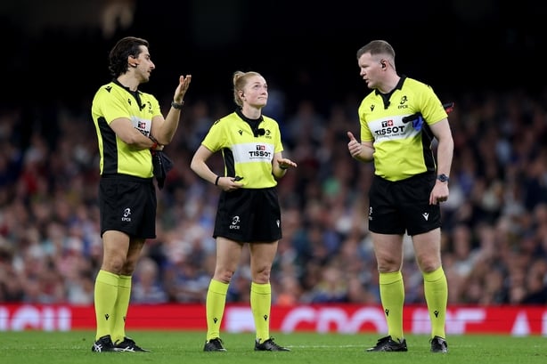 CARDIFF, WALES - MAY 23: Referee Hollie Davidson (C) speaks to her assistants Gianluca Gnecchi (L) and Eoghan Cross during the EPCR Challenge Cup 2024/2025 final match between Bath Rugby and Lyon Olympique Universitaire at Principality Stadium on May 23, 2025 in Cardiff, Wales. (Photo by Michael Ste