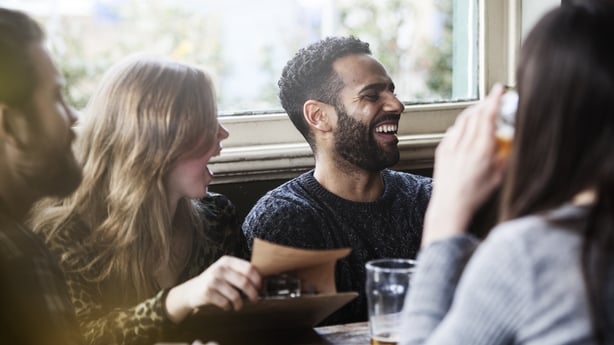 A group of friends at the local pub having a good time
