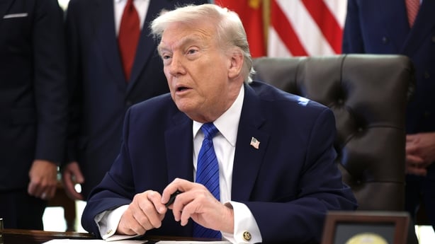 US President Donald Trump delivers remarks before signing an executive order in the Oval Office of the White House on January 30, 2026