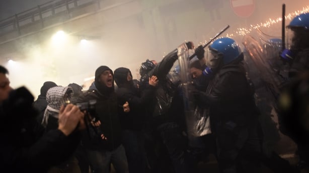 In Milan, Italy, on the left of the image, the protesters stand, and on the right, the police with batons charge the banner during the CIO committee protest. (Photo by Mattia Rinaldi/NurPhoto via Getty Images)