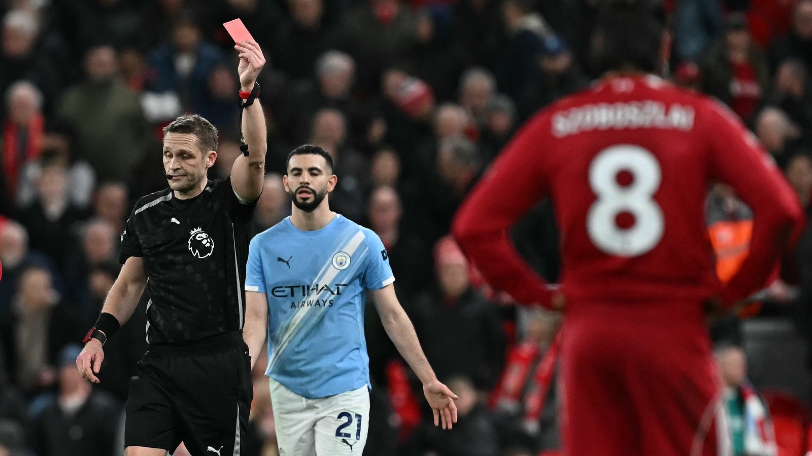City keep title hopes alive with dramatic Anfield win