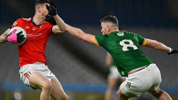 14 February 2026; Ciaran Downey of Louth in action against Bryan Menton of Meath during the Allianz Football League Division 2 match between Meath and Louth at Croke Park in Dublin. Photo by Ray McManus/Sportsfile