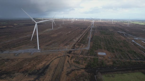 a large number of wind turbines in the countryside